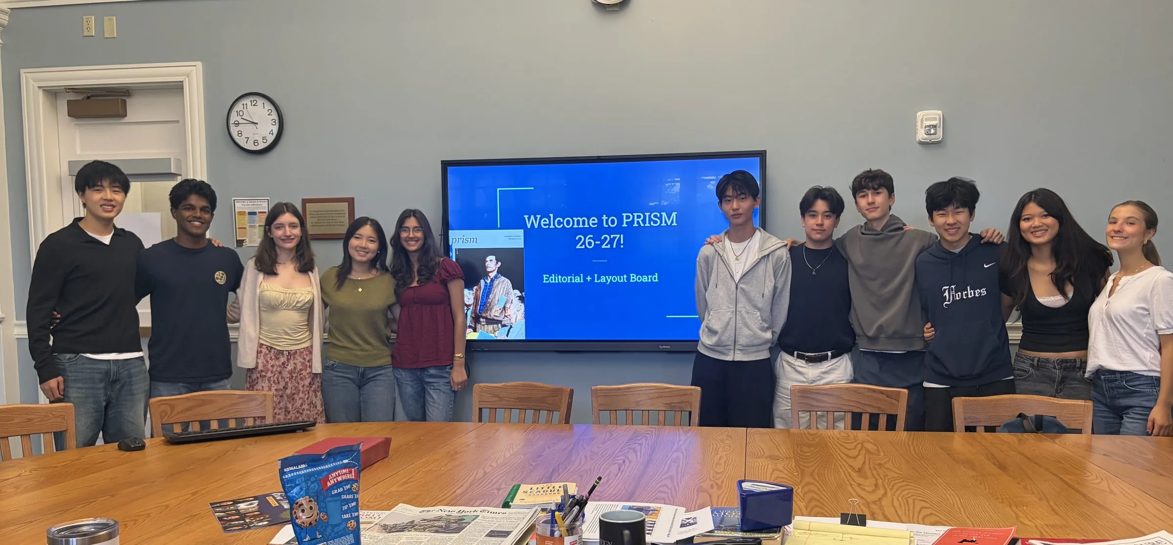 Group photo: The 2026–27 editorial and layout board.